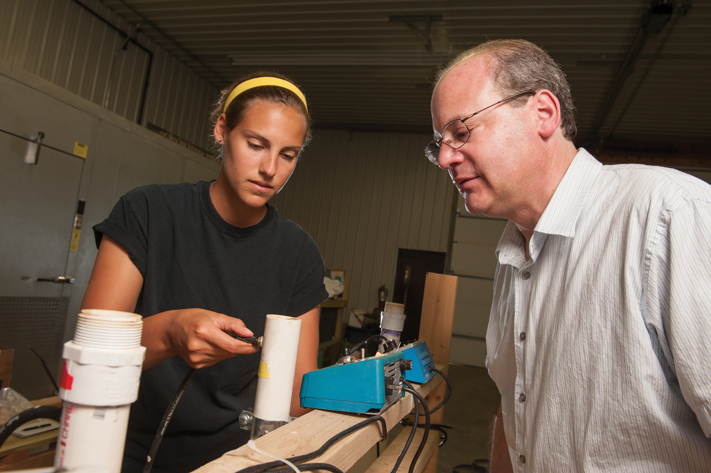 A professor helps a student with research