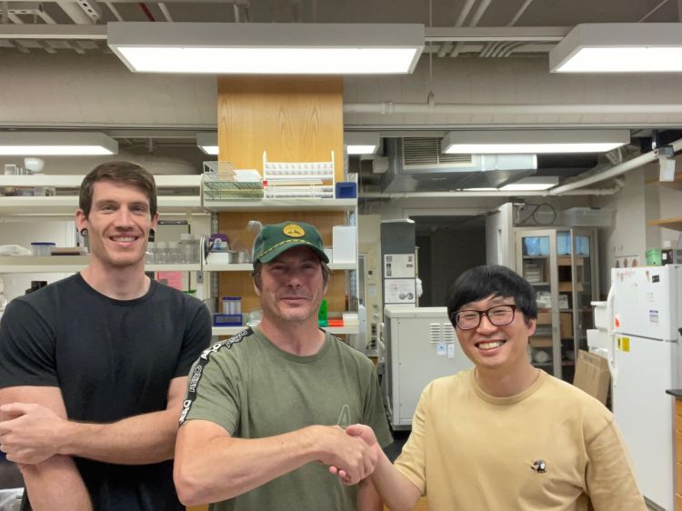 MSU Animal Science Professor Jason Knott and his research team, consisting of post-doctoral scientist Jaehwan Kim and graduate student Chad Driscoll.