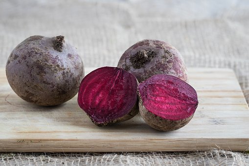 Purple beets on a cutting board