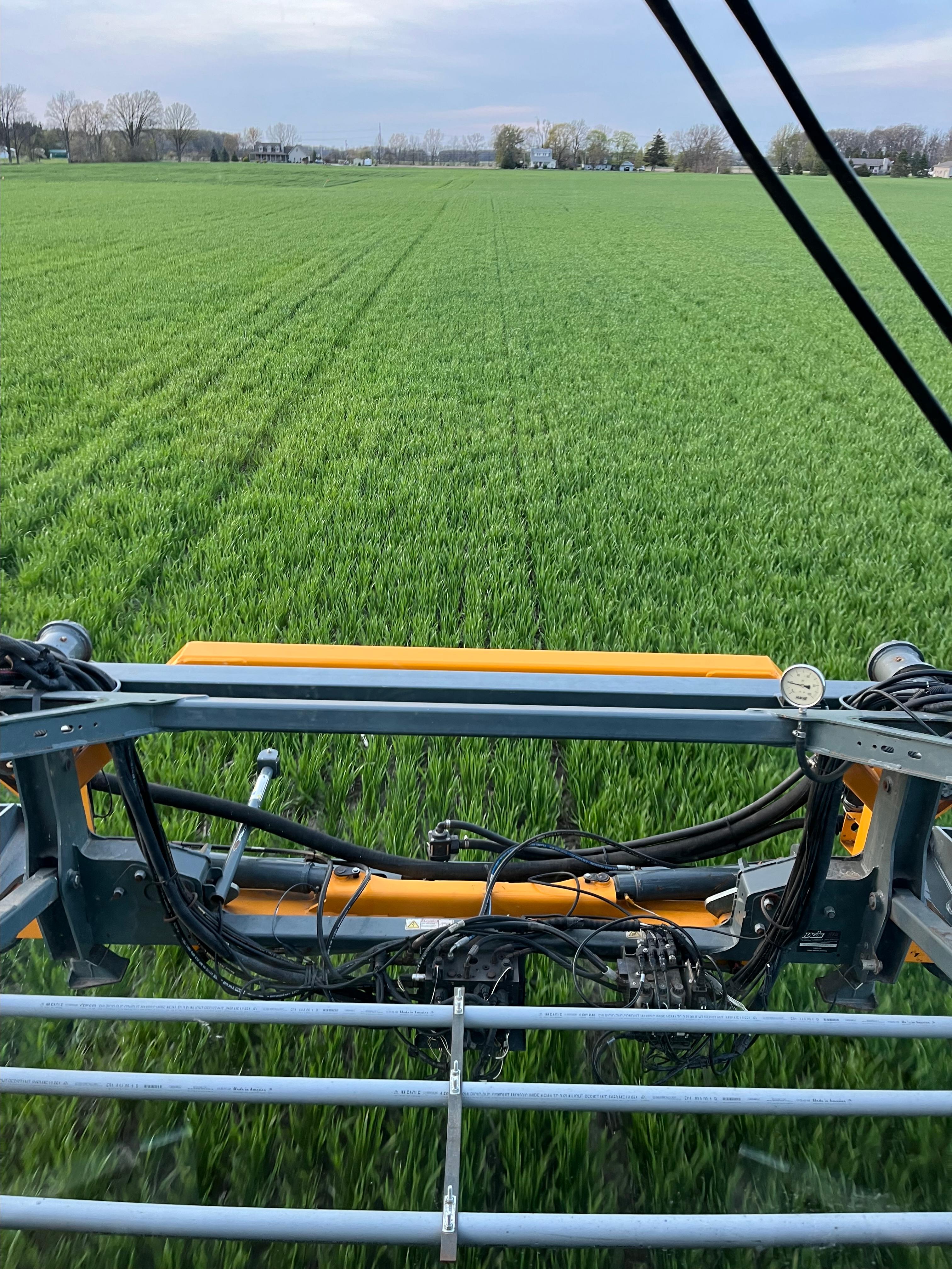 Spraying fertilizer in a wheat field.