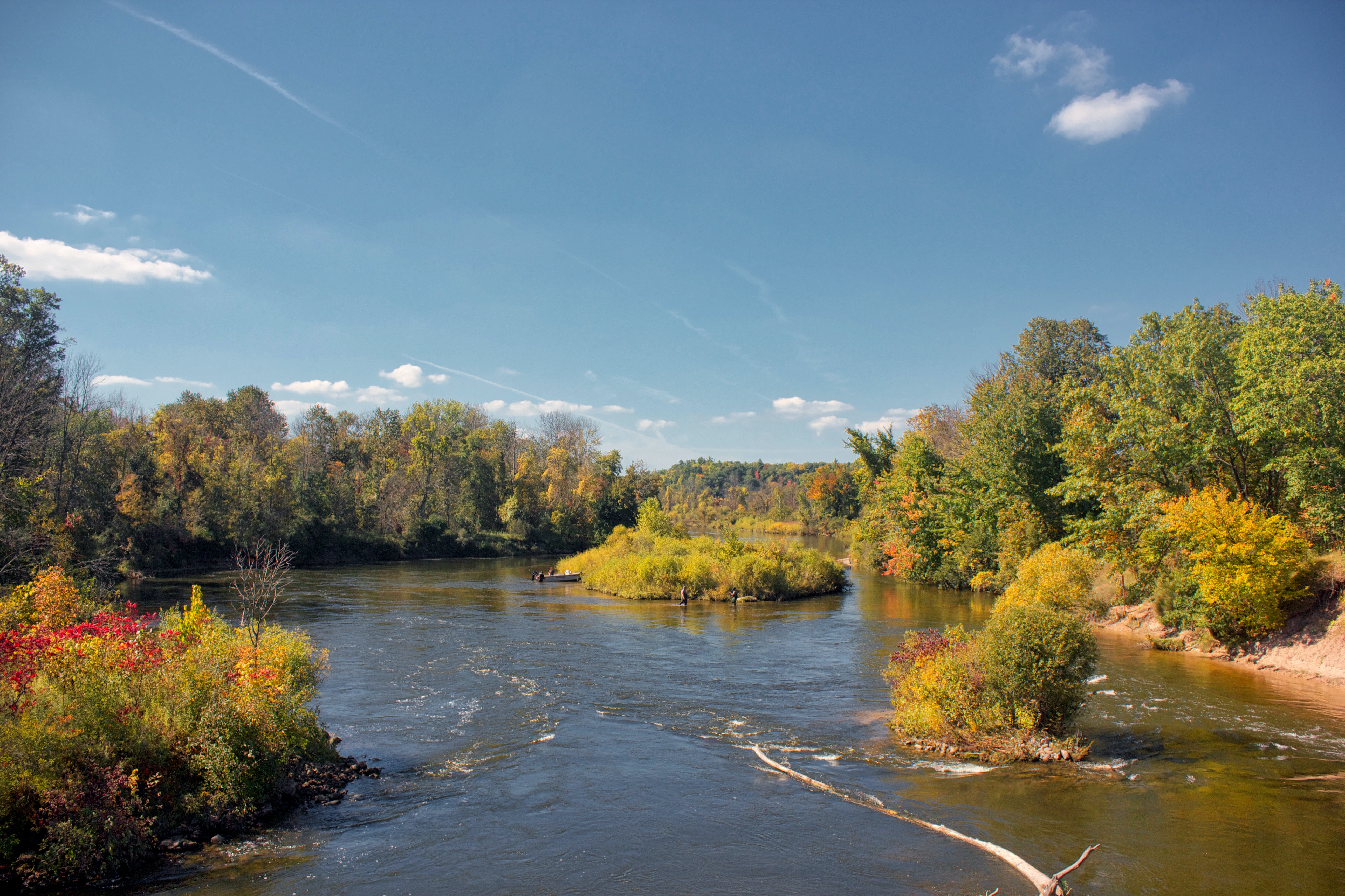 River surrounded by trees with fall colors